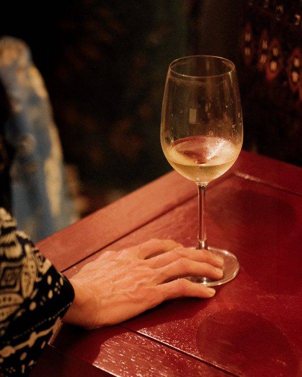 Event photography detail shot of a wine glass at an evening event in Penang