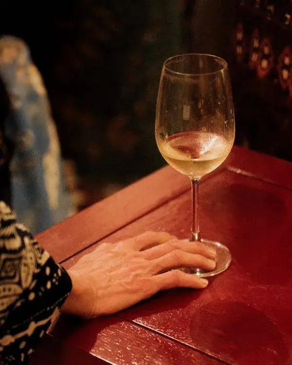 Event photography detail shot of a wine glass at an evening event in Penang