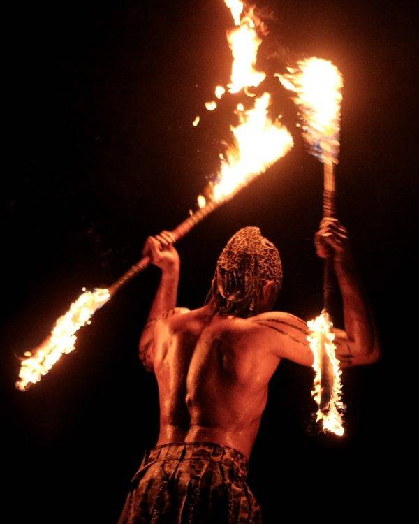 Penang event photographer capturing a fire performer at a cultural celebration