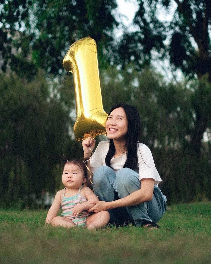 Penang event photographer capturing a mother and baby celebrating a first birthday