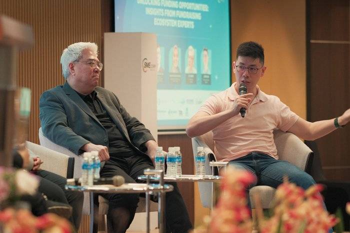 Penang event photographer capturing a panel discussion at a conference