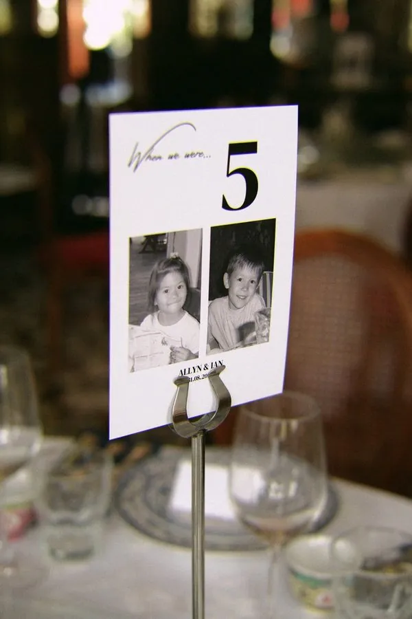 Wedding table number card with childhood photos of the bride and groom